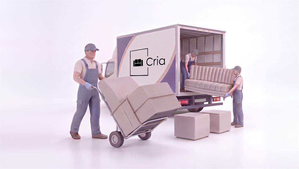 Movers unloading a channel-back sofa and packed cushions from a Cria delivery truck